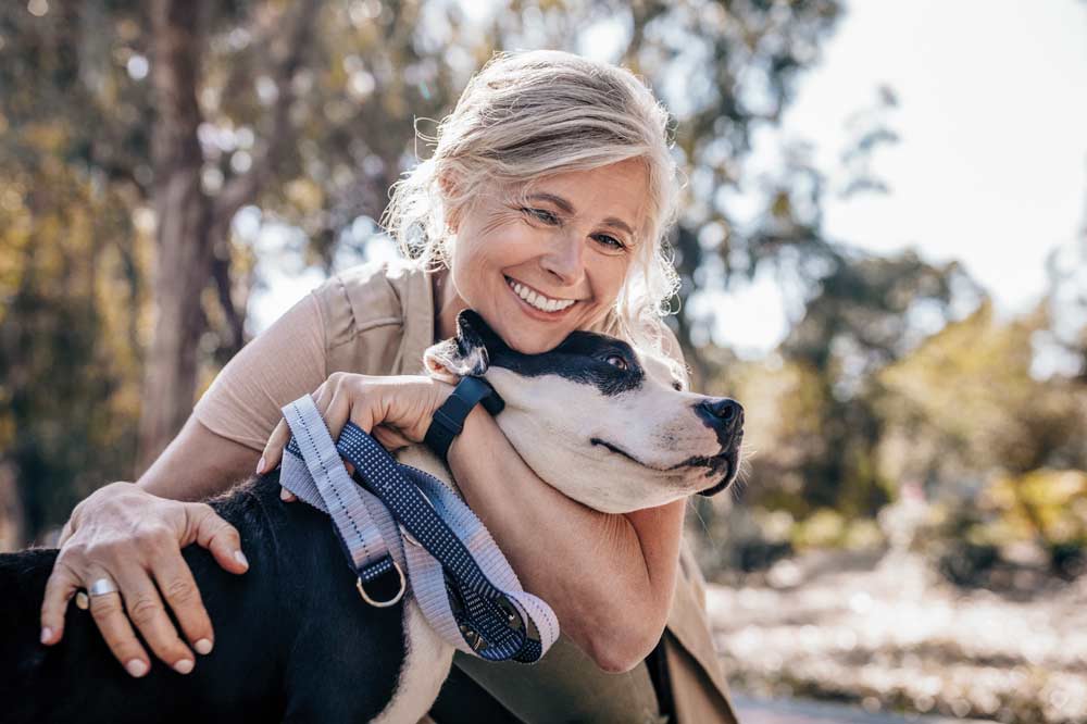 Woman smiling with dog